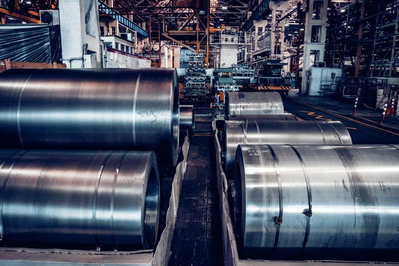 Stock with rolls of sheet steel in industrial plant